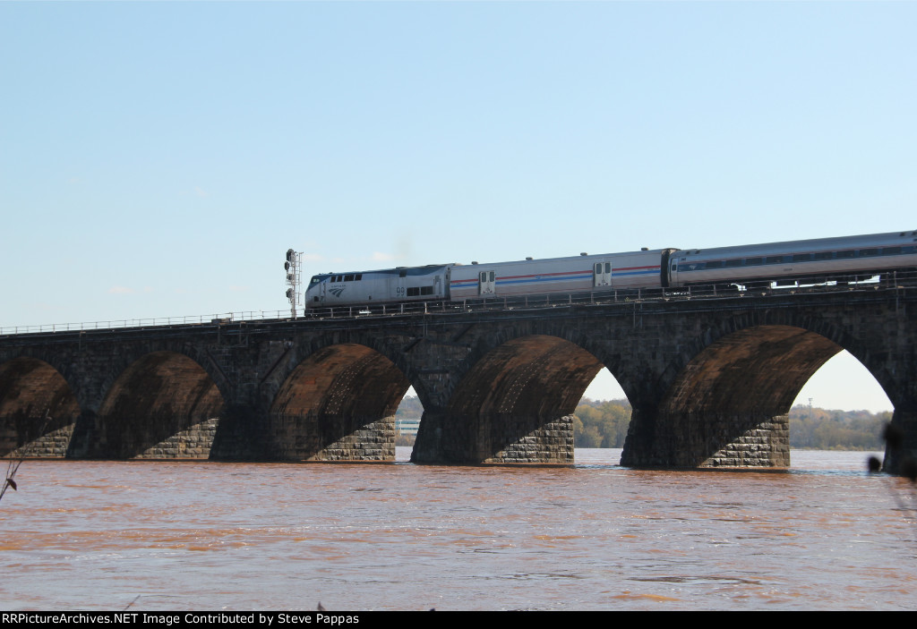 AMTK 99 leads the eastbound Pennsylvanian over Rockville bridge into Harrisburg